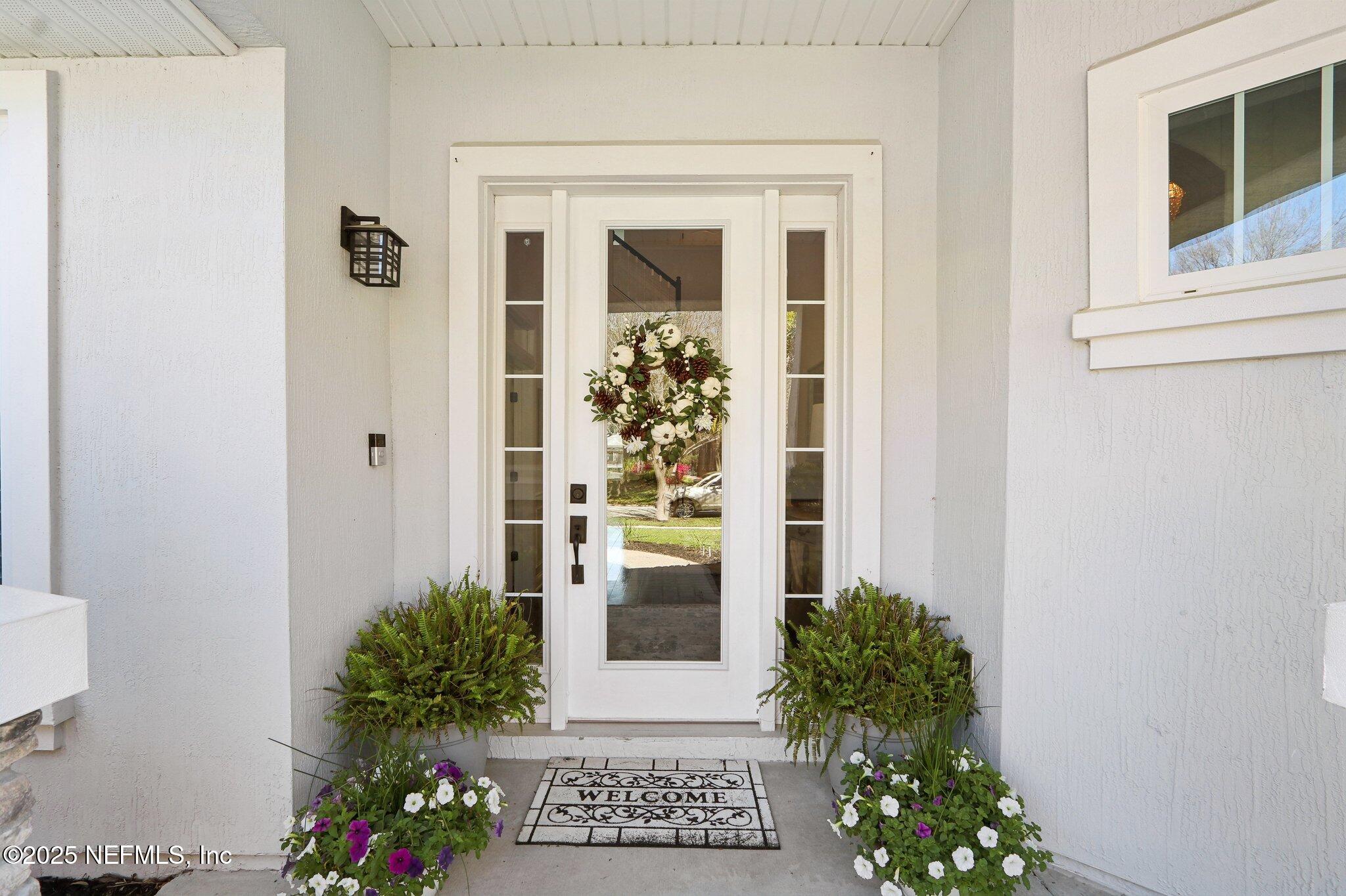 212 Cornwall Drive Ponte Vedra, FL 32081 - Photo 5 of 84 front view of a house with a potted plant
