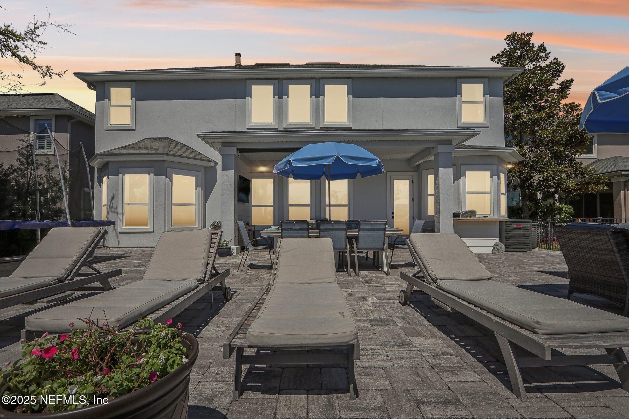212 Cornwall Drive Ponte Vedra, FL 32081 - Photo 58 of 84 a view of a dinning table and chairs in patio