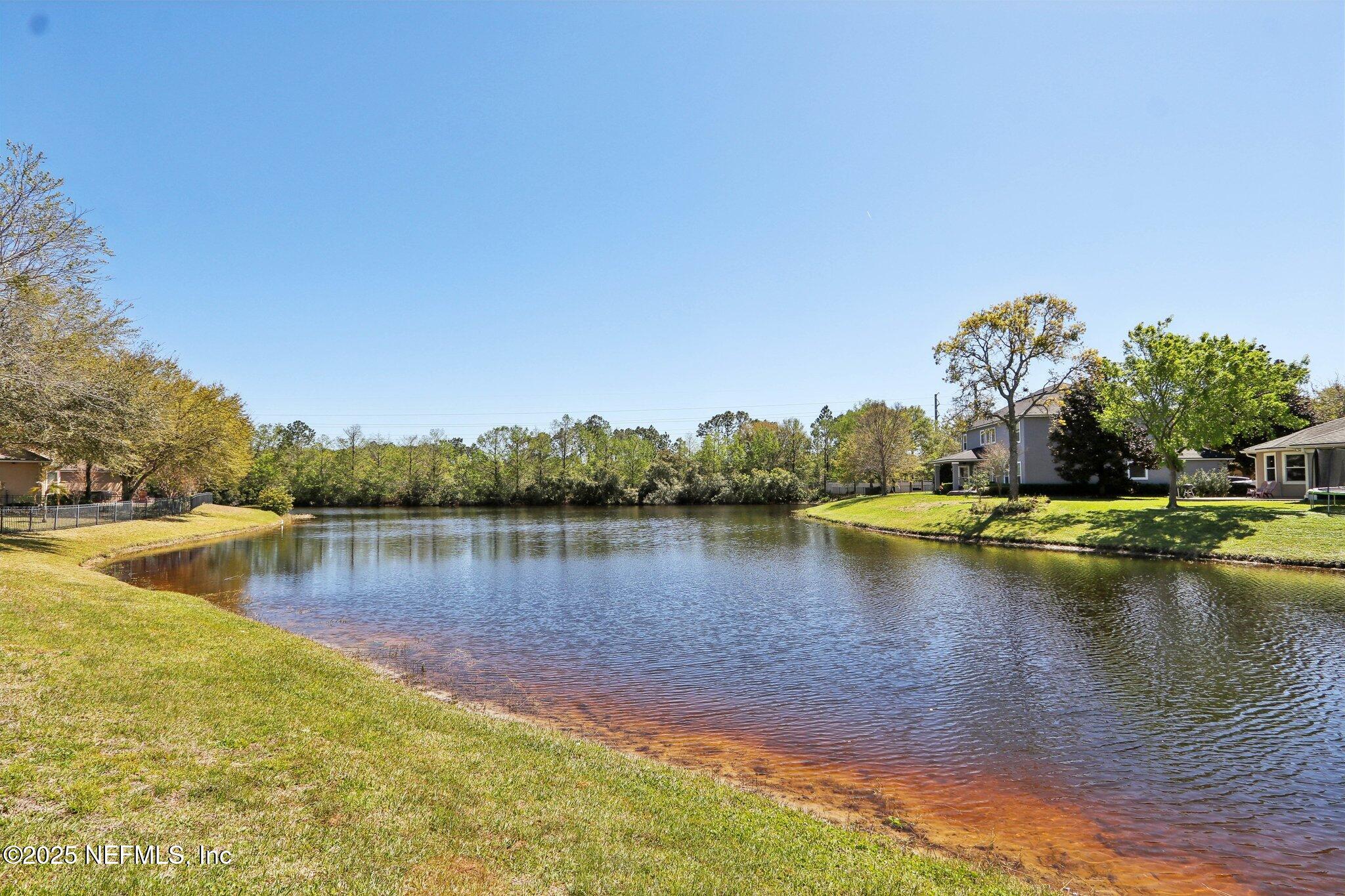 212 Cornwall Drive Ponte Vedra, FL 32081 - Photo 59 of 84 a view of a lake with houses