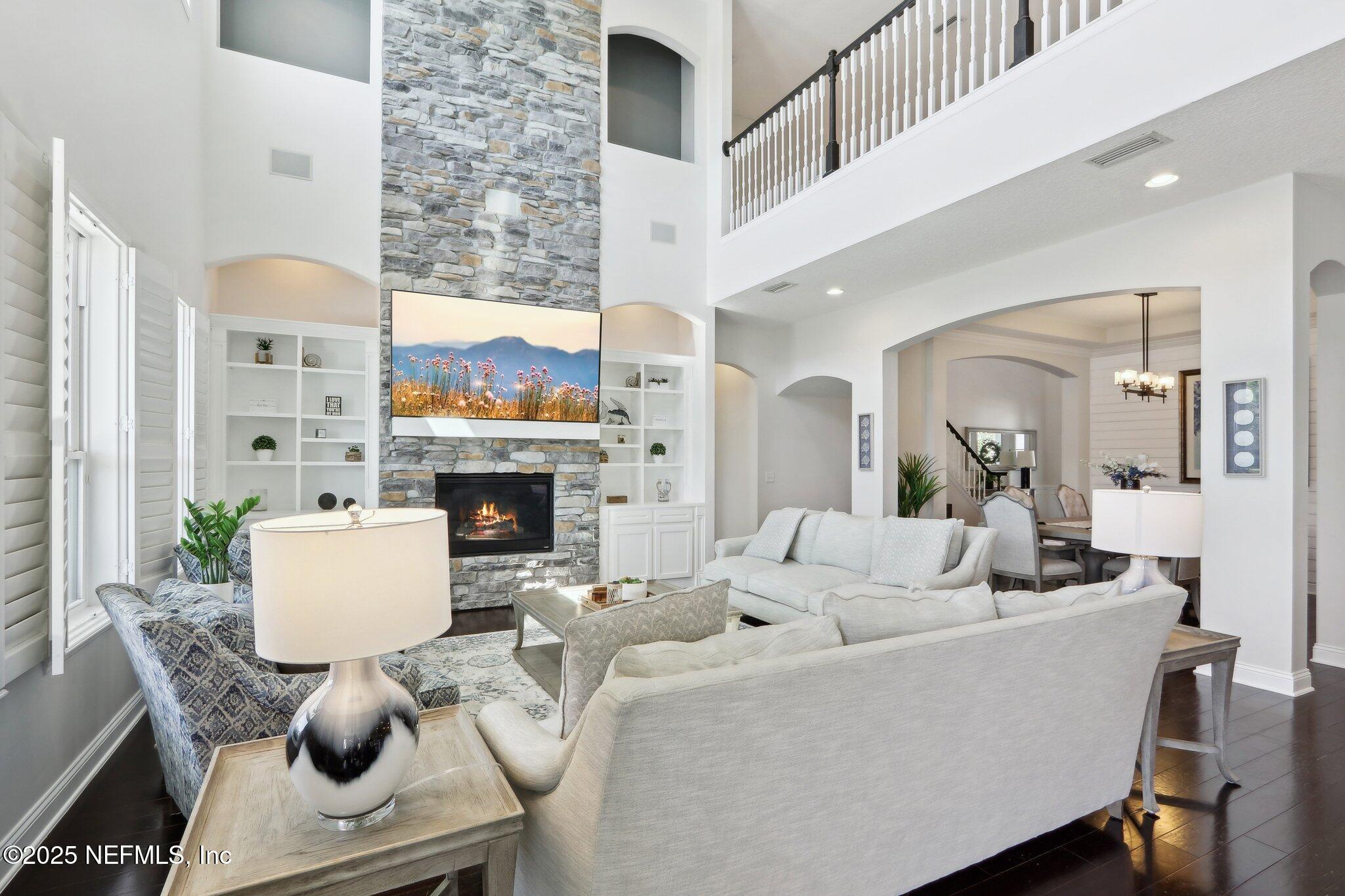 212 Cornwall Drive Ponte Vedra, FL 32081 - Photo 8 of 84 a living room with furniture and a fireplace