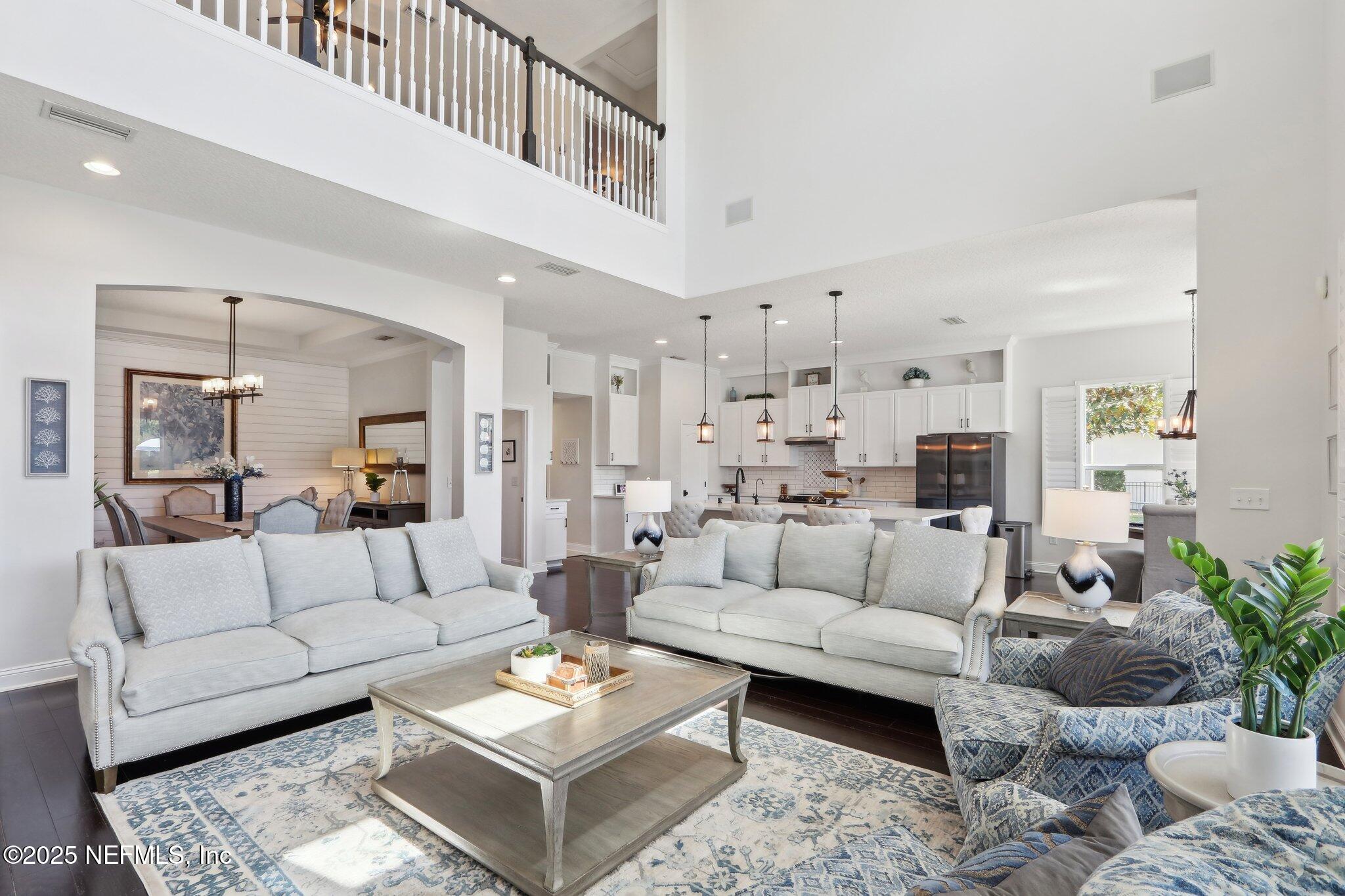 212 Cornwall Drive Ponte Vedra, FL 32081 - Photo 10 of 84 a living room with furniture kitchen view and a potted plant