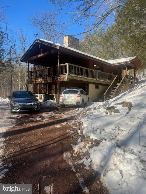 140 Clay Ridge Road Ottsville, PA 18942 - Photo 2 of 10 Charming cabin nestled in a snowy landscape.