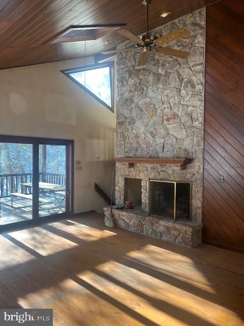 140 Clay Ridge Road Ottsville, PA 18942 - Photo 7 of 10 Sunlit living space with rustic stone fireplace.
