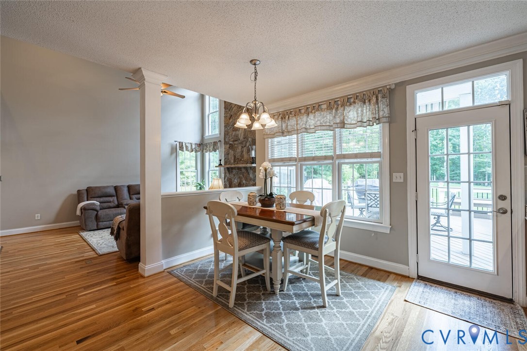 15021 River Road Chesterfield, VA 23838 - Photo 11 of 50 a view of a dining room with furniture window and wooden floor