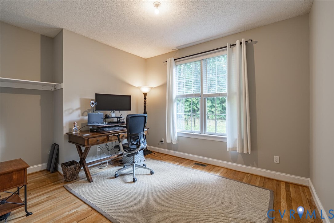 15021 River Road Chesterfield, VA 23838 - Photo 19 of 50 a view of a workspace with furniture and a window