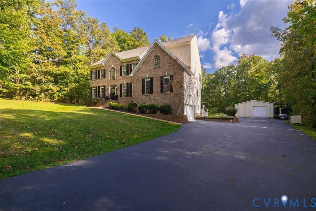 15021 River Road Chesterfield, VA 23838 - Photo 2 of 50 a front view of a house with yard and green space
