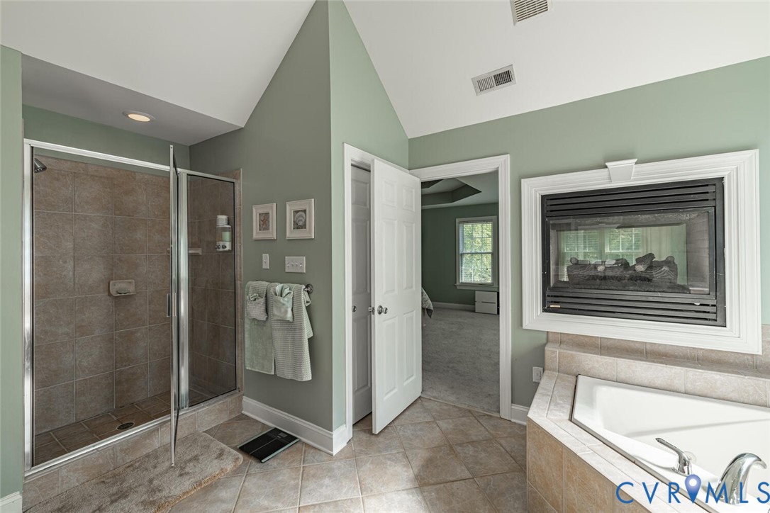15021 River Road Chesterfield, VA 23838 - Photo 26 of 50 a bathroom with a tub and shower