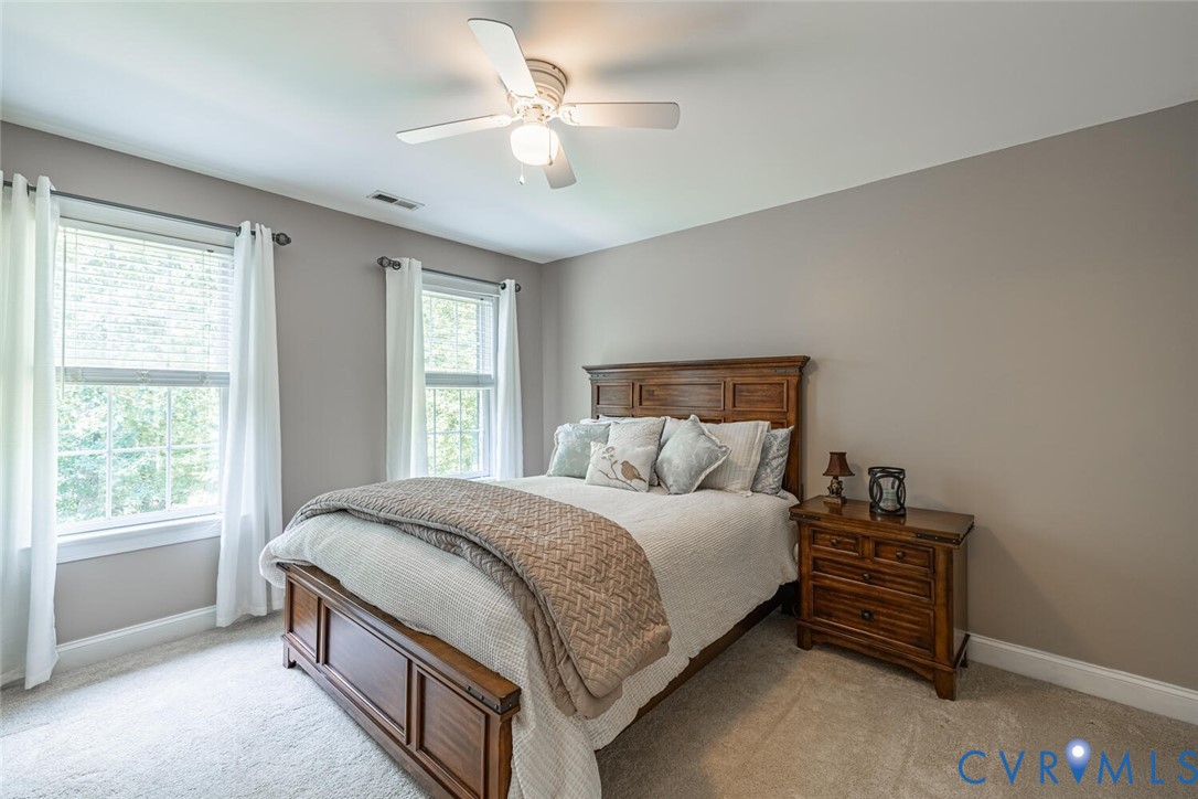 15021 River Road Chesterfield, VA 23838 - Photo 30 of 50 a bedroom with a bed and a window