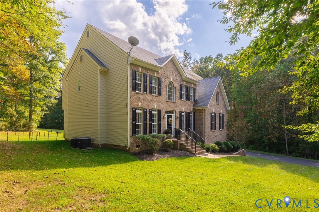15021 River Road Chesterfield, VA 23838 - Photo 3 of 50 a front view of house with yard and green space