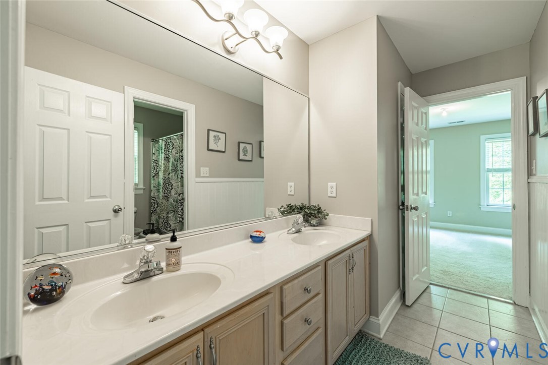 15021 River Road Chesterfield, VA 23838 - Photo 33 of 50 a bathroom with a double vanity sink mirror and shower