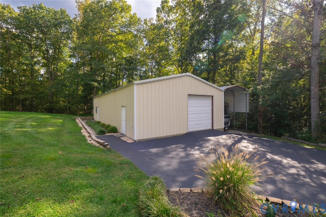 15021 River Road Chesterfield, VA 23838 - Photo 35 of 50 a view of a house with backyard and garden
