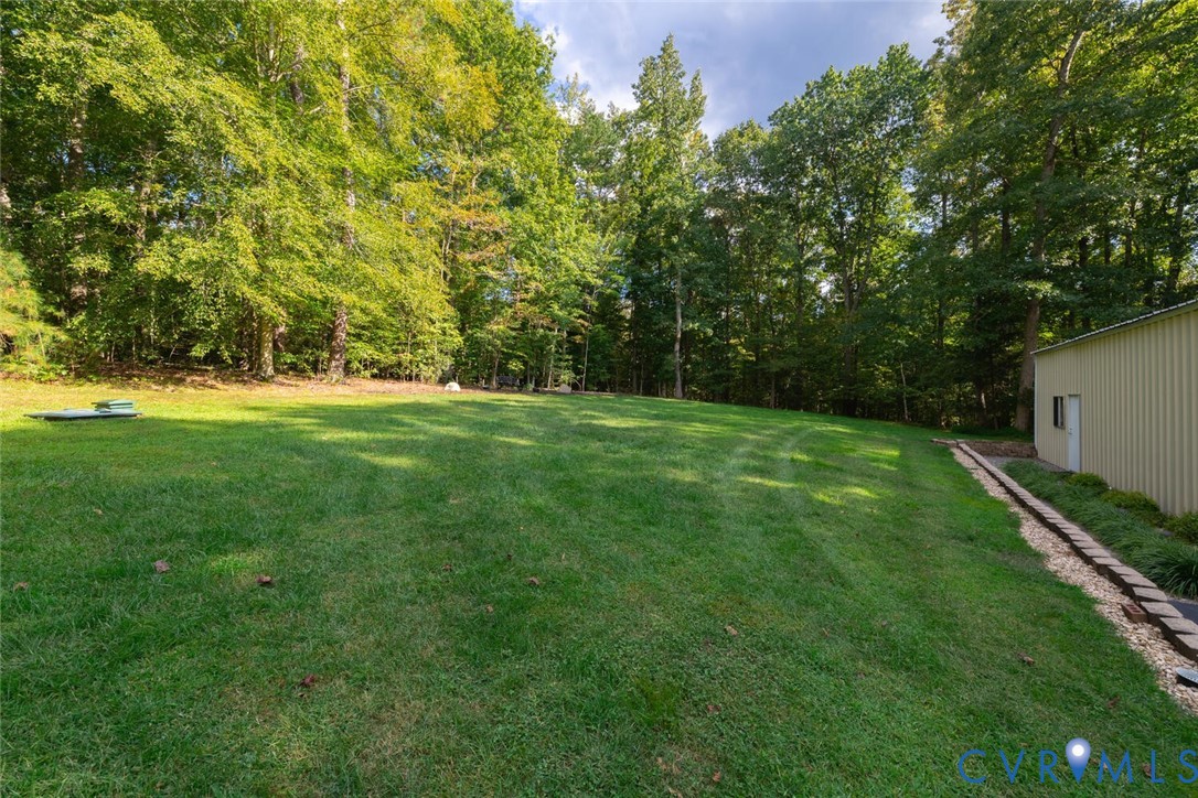 15021 River Road Chesterfield, VA 23838 - Photo 40 of 50 a view of a big yard with plants and large trees