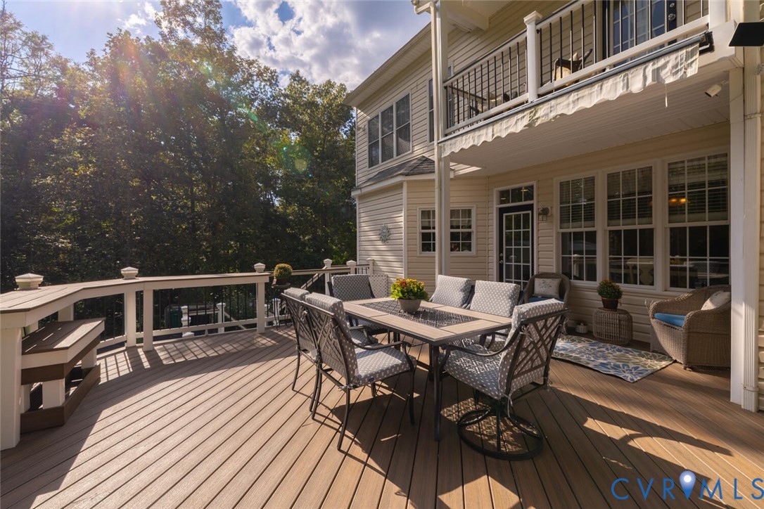 15021 River Road Chesterfield, VA 23838 - Photo 42 of 50 a roof deck with table and chairs and wooden floor
