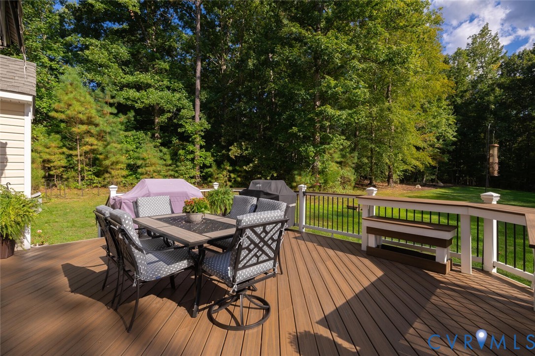 15021 River Road Chesterfield, VA 23838 - Photo 43 of 50 a view of a patio with table and chairs with wooden floor and fence
