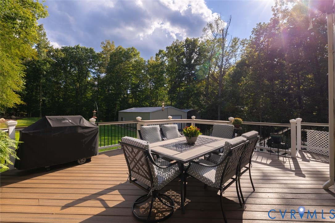 15021 River Road Chesterfield, VA 23838 - Photo 45 of 50 a view of a dinning table and chairs on the deck