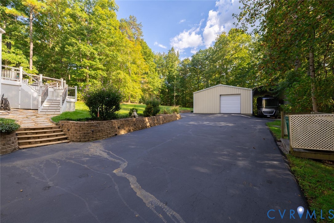 15021 River Road Chesterfield, VA 23838 - Photo 46 of 50 a view of a house with backyard and a tree
