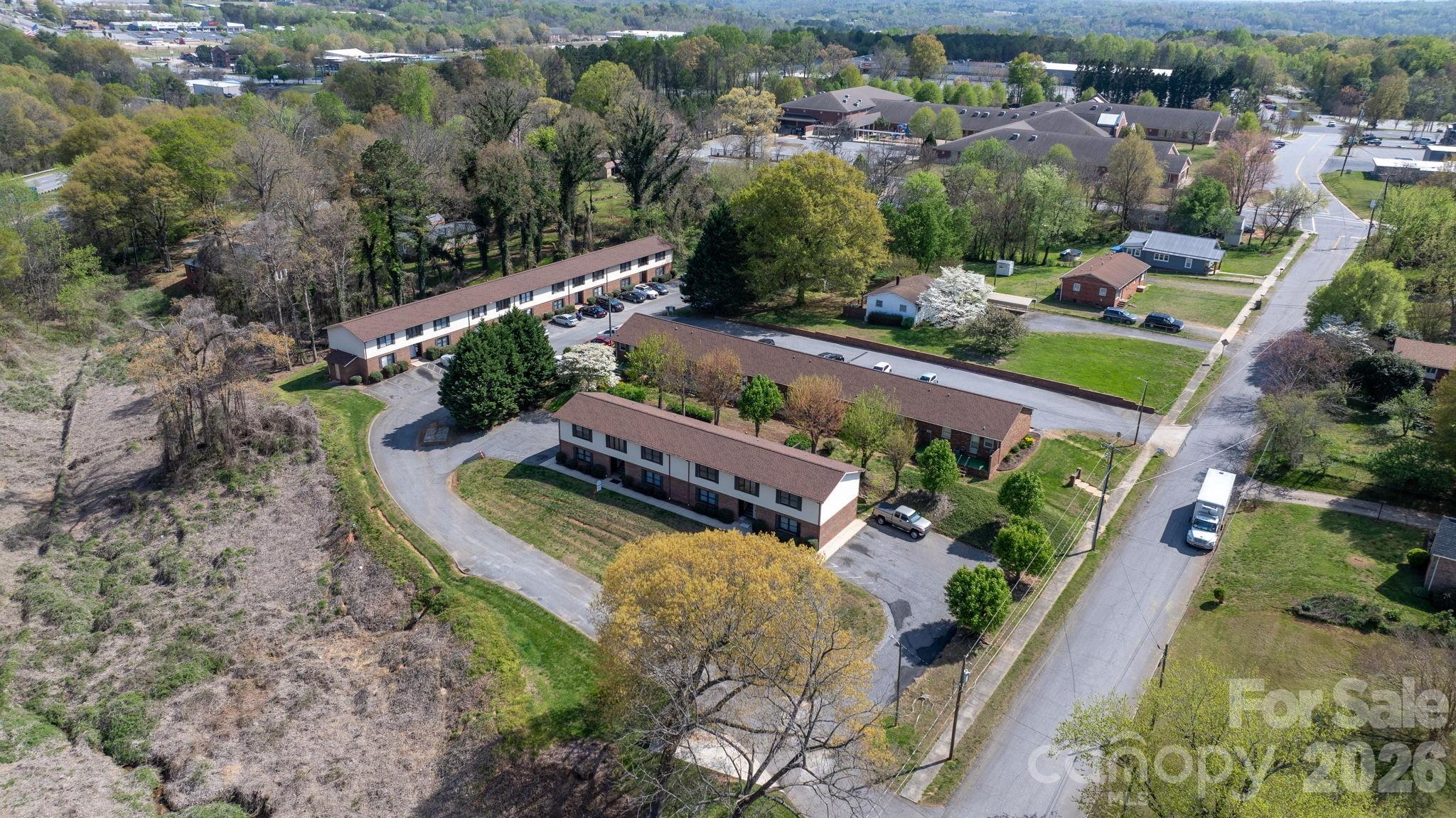 525 12th Street Southwest, Unit 26 Hickory, NC 28602 - Photo 21 of 21 an aerial view of a house with a garden and lake view