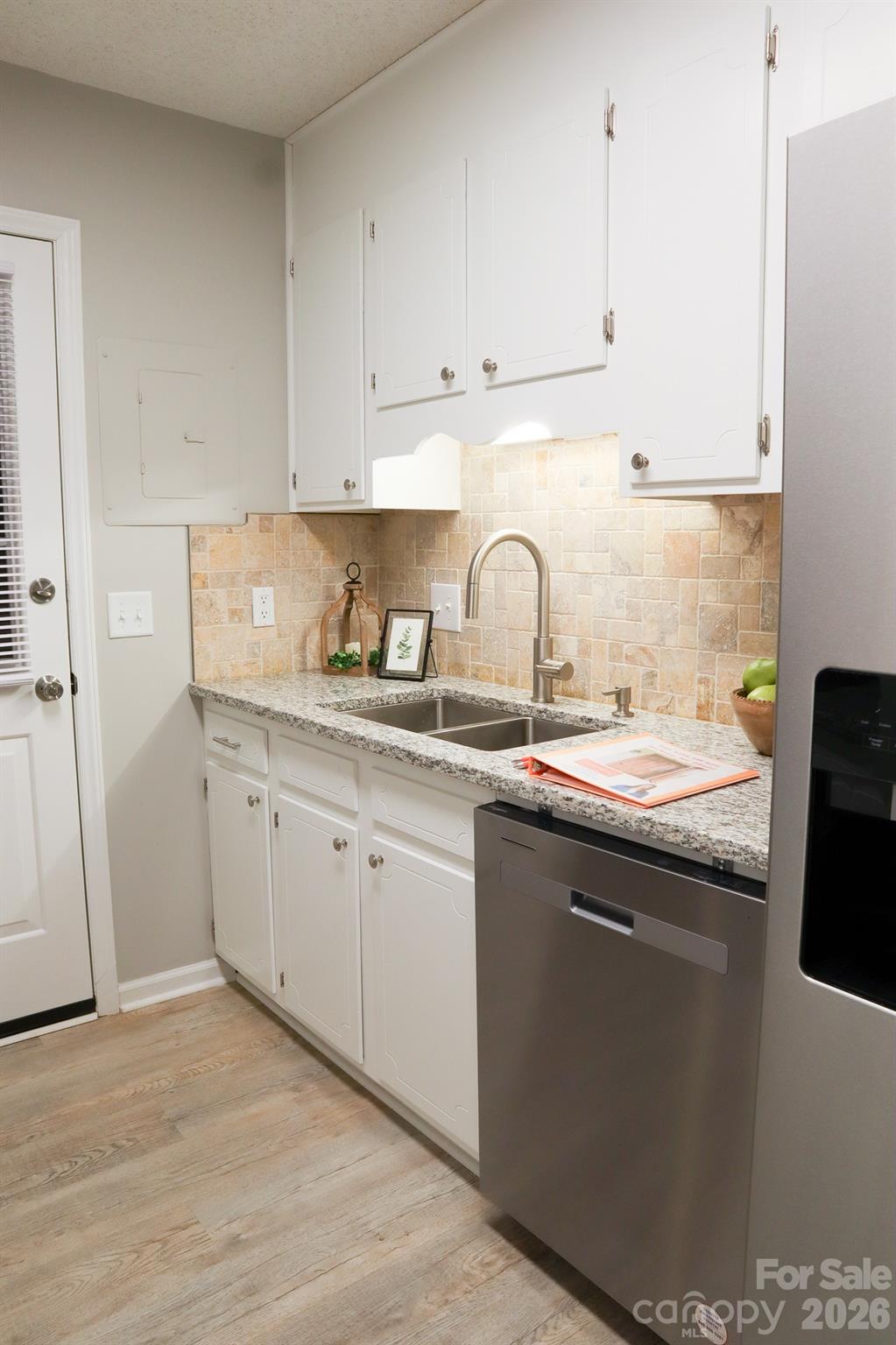 525 12th Street Southwest, Unit 26 Hickory, NC 28602 - Photo 6 of 21 a kitchen with stainless steel appliances granite countertop a sink stove and refrigerator