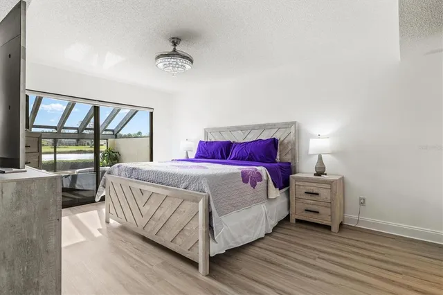 a spacious bathroom with a granite countertop sink and a mirror