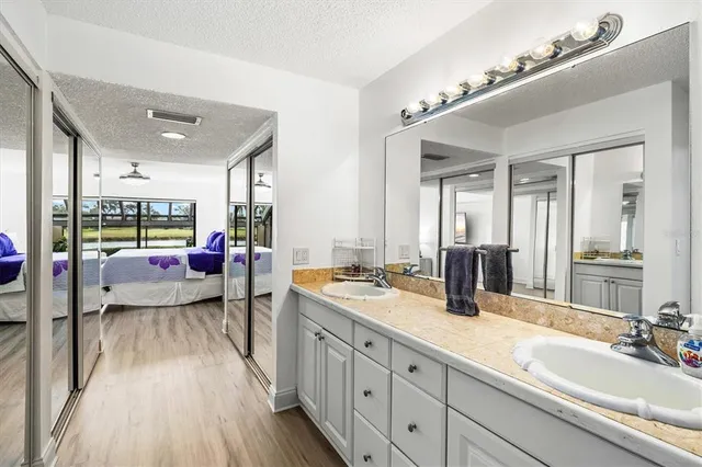 a bedroom with a large bed and a large window