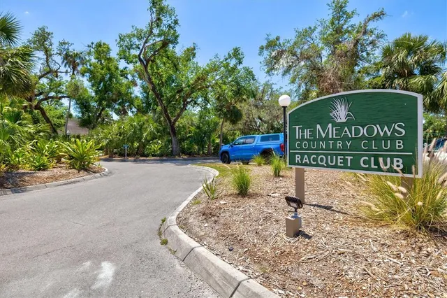 a view of a backyard with sitting area