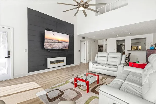 a living room with furniture and a flat screen tv