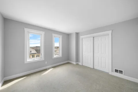 a view of an empty room and closet area