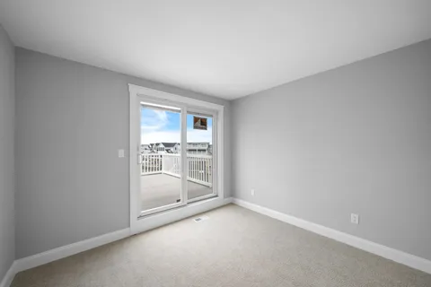 a view of an empty room and closet area