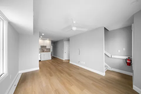 a view of a balcony with wooden floor space