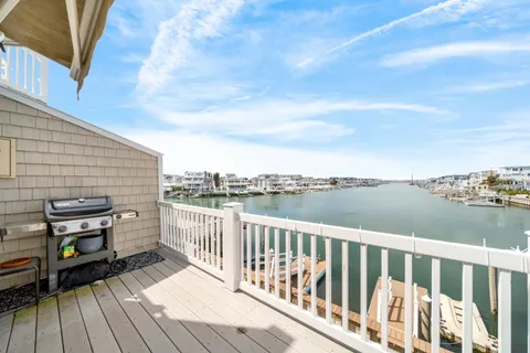 an outdoor space with lake view and boat