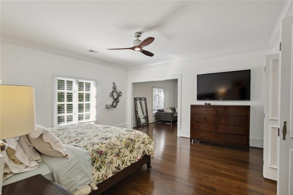 2760 Carmon On Wesley Northwest Atlanta, GA 30327 - Photo 15 of 30 a bedroom with a bed and a flat screen tv