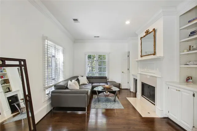a living room with furniture fireplace and window