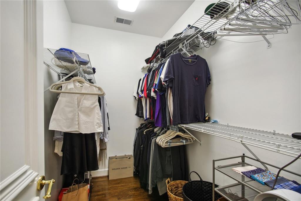 2760 Carmon On Wesley Northwest Atlanta, GA 30327 - Photo 20 of 30 a view of walk in closet with clothes and shoes