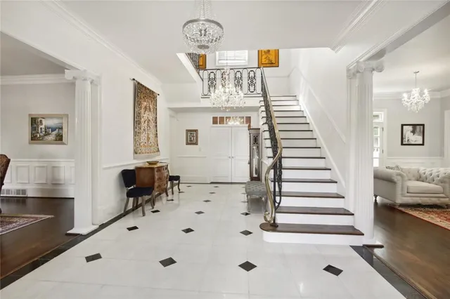 a view of entryway and hall with wooden floor
