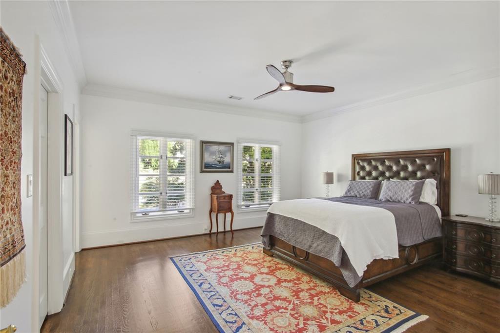 2760 Carmon On Wesley Northwest Atlanta, GA 30327 - Photo 22 of 30 a bedroom with a large bed and a window