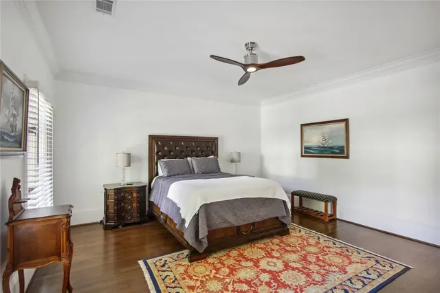 a bedroom with a bed and a chair