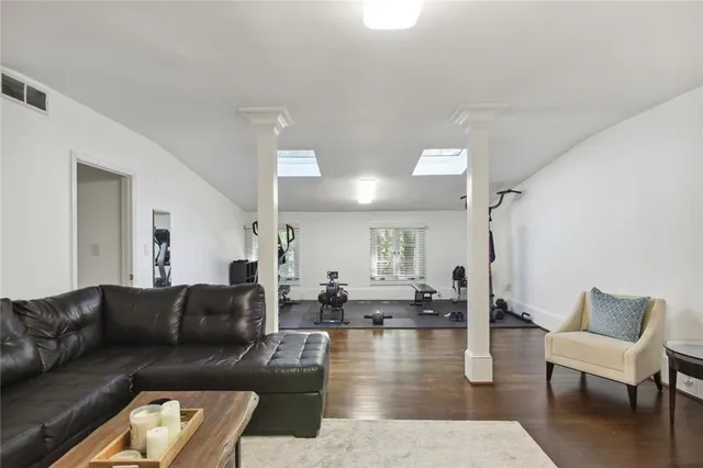 a living room with furniture or couch and a wooden floor