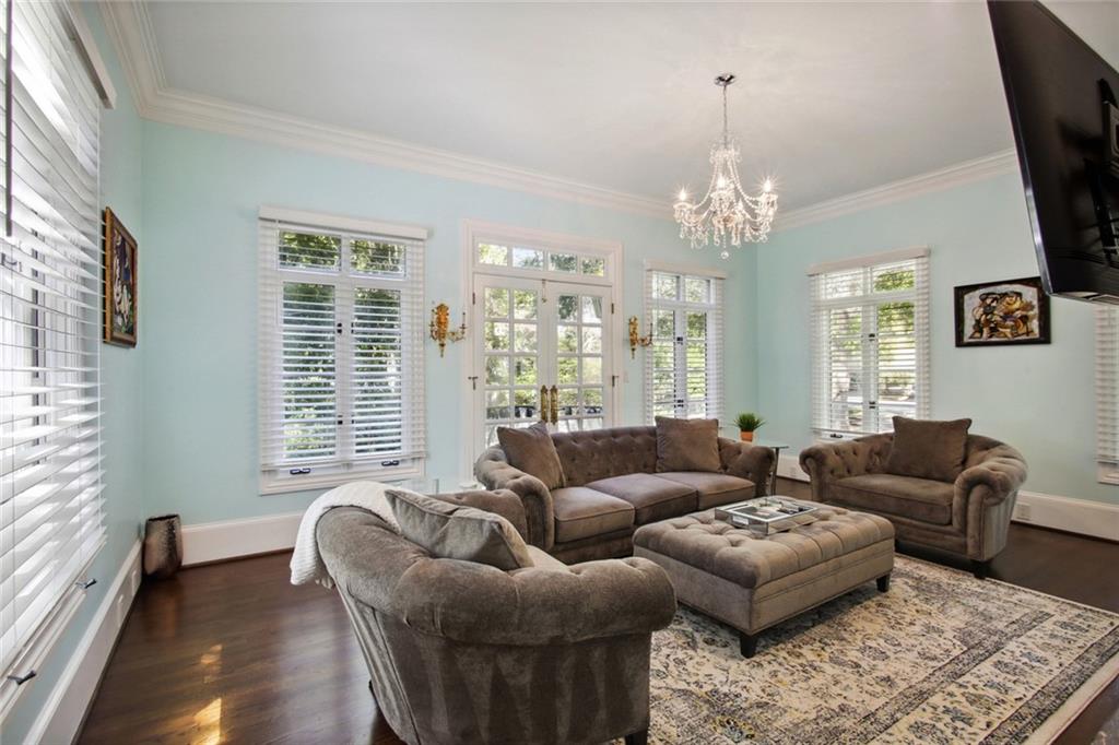 2760 Carmon On Wesley Northwest Atlanta, GA 30327 - Photo 6 of 30 a living room with furniture and a chandelier