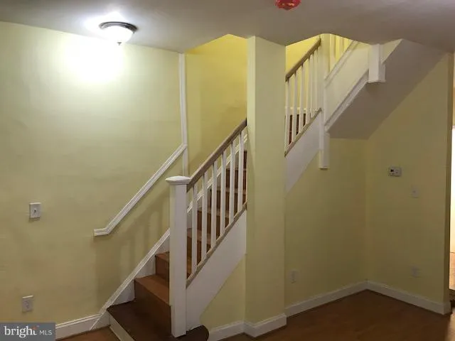 a view of entryway with wooden floor