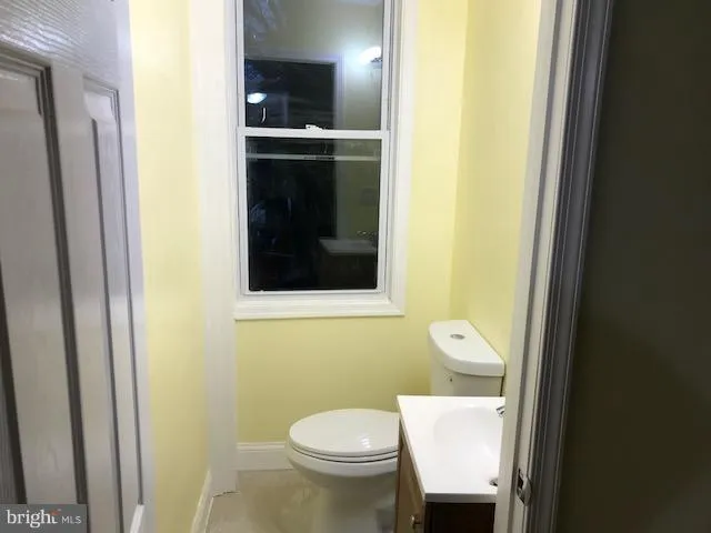 a bathroom with a toilet and a sink