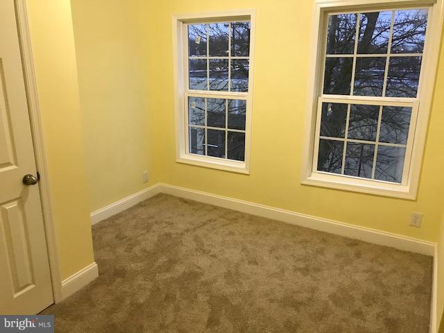 3010 Overland Avenue Baltimore, MD 21214 - Photo 10 of 11 a view of an empty room with a window