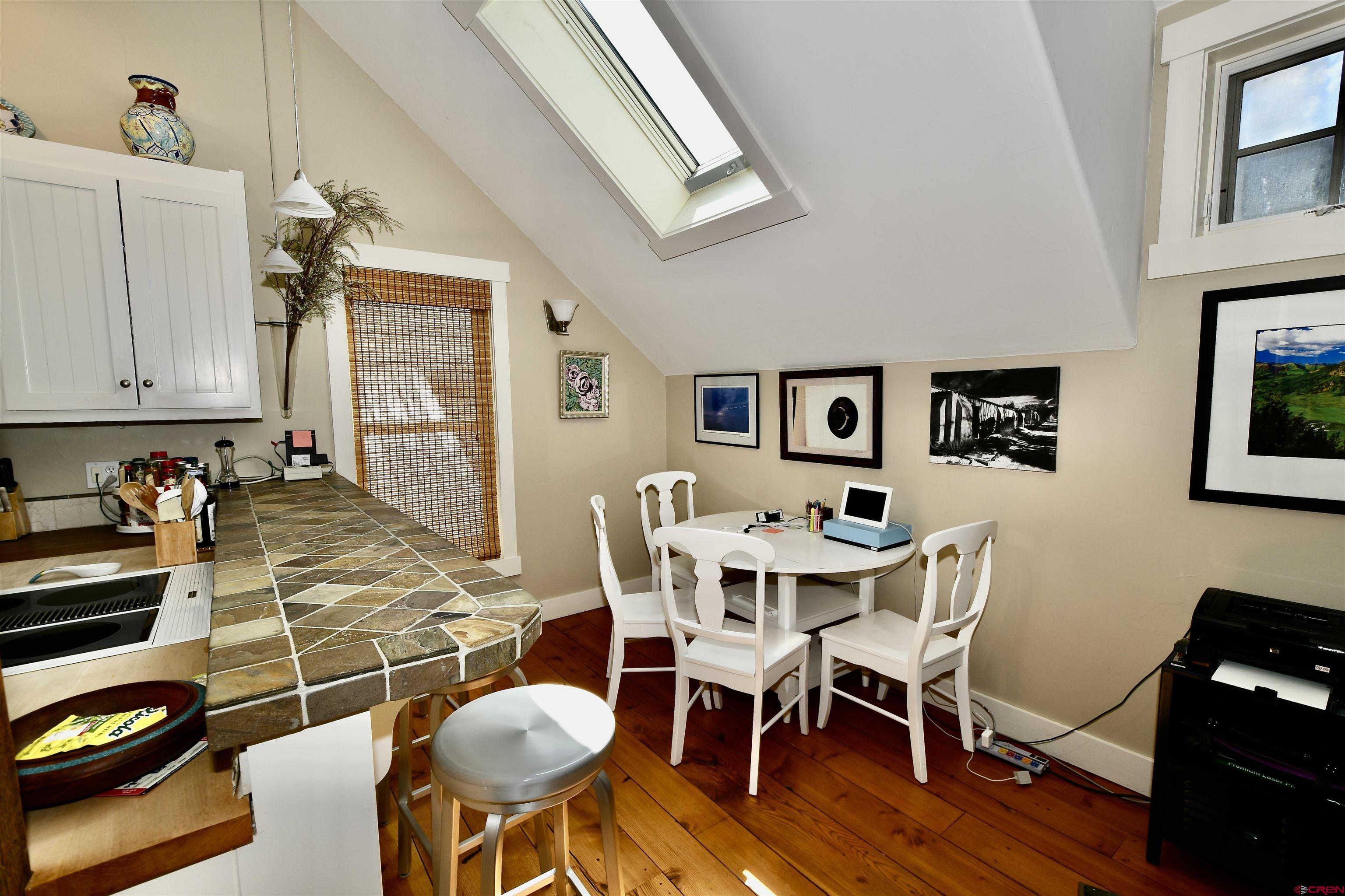 602-604 4th Street Crested Butte, CO 81224 - Photo 12 of 45 a view of a dining room with furniture and wooden floor
