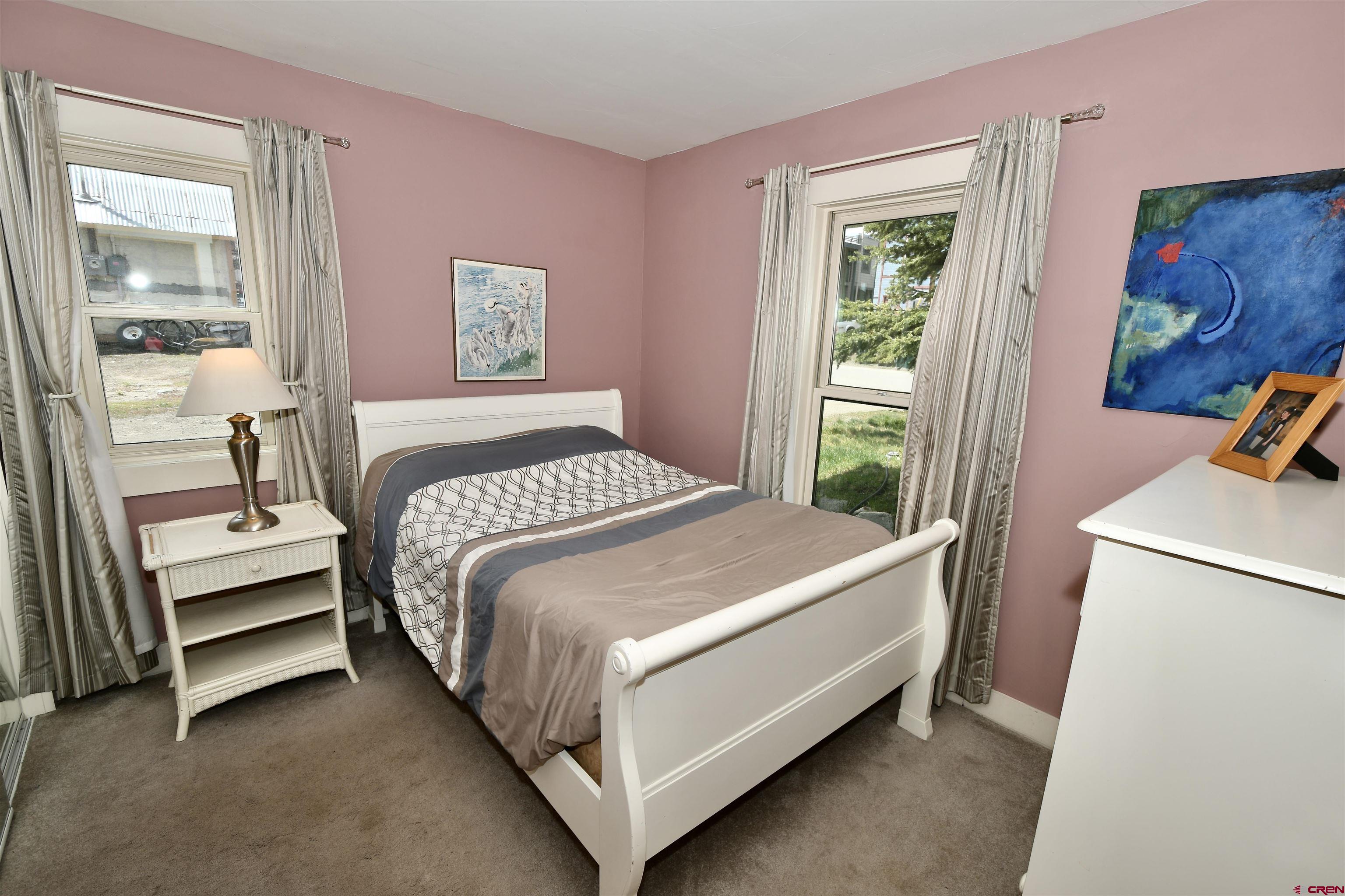 602-604 4th Street Crested Butte, CO 81224 - Photo 22 of 45 a bedroom with a bed and a window