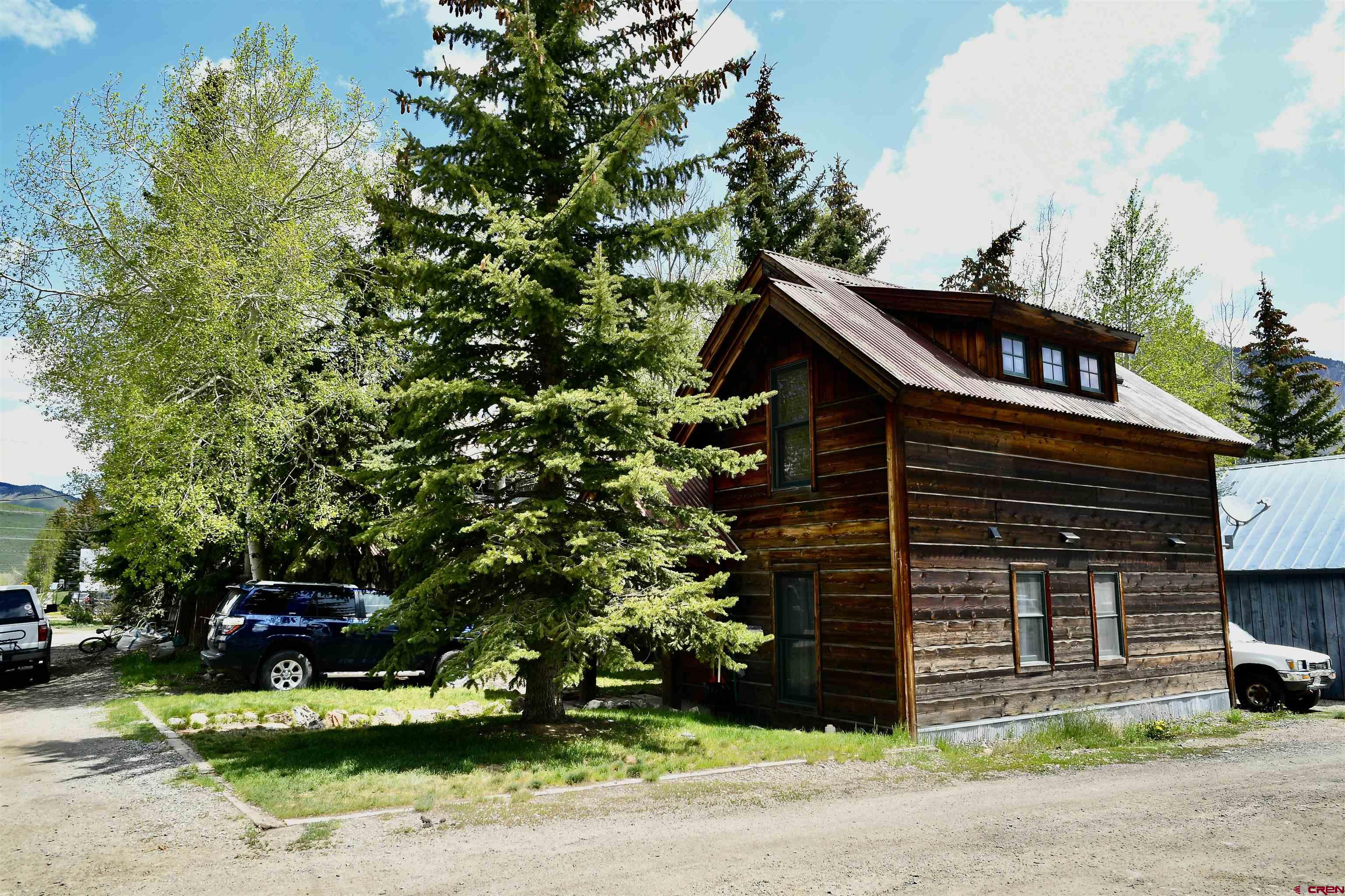 602-604 4th Street Crested Butte, CO 81224 - Photo 23 of 45 a front view of a house with a yard