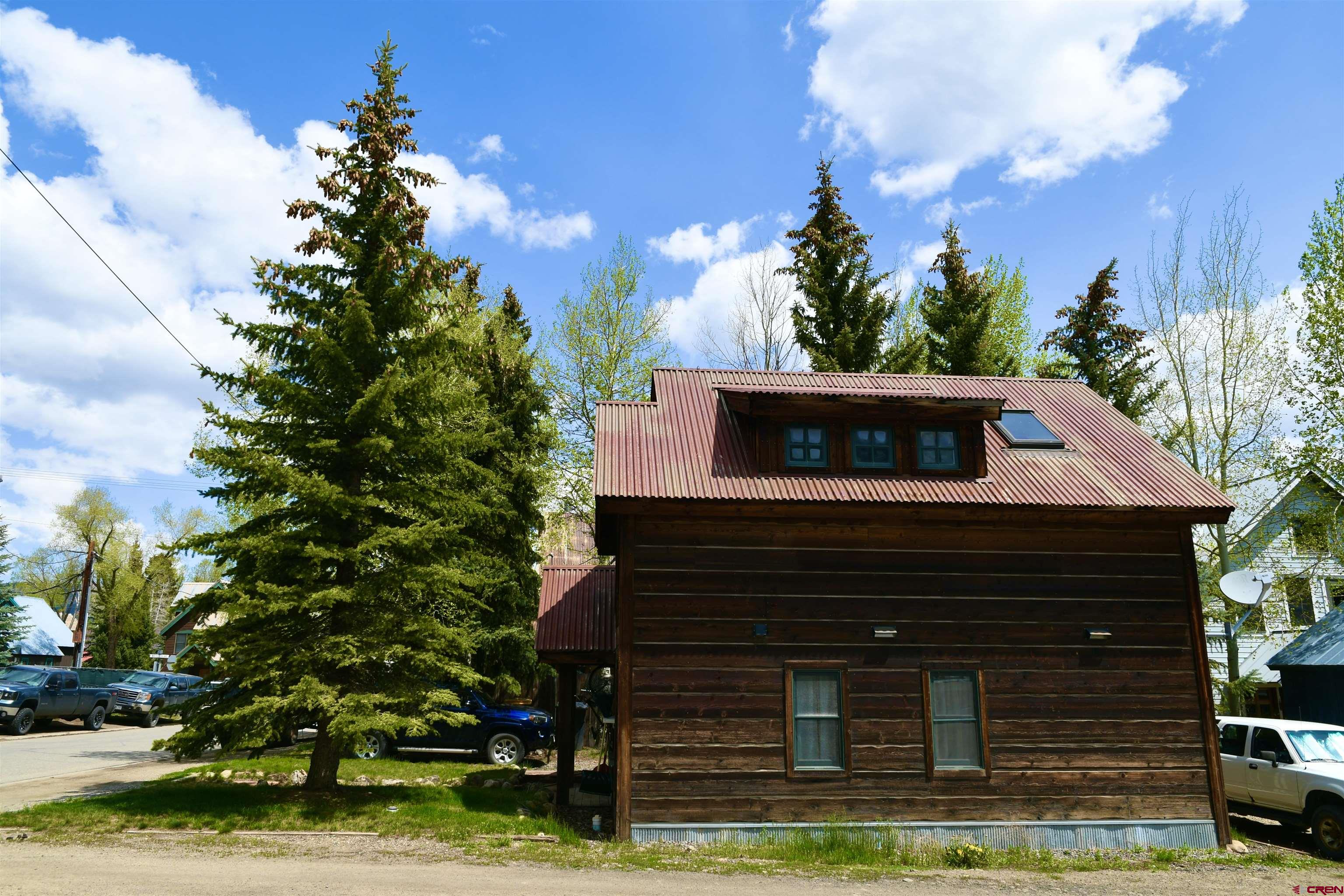 602-604 4th Street Crested Butte, CO 81224 - Photo 24 of 45 a front view of a house with garden