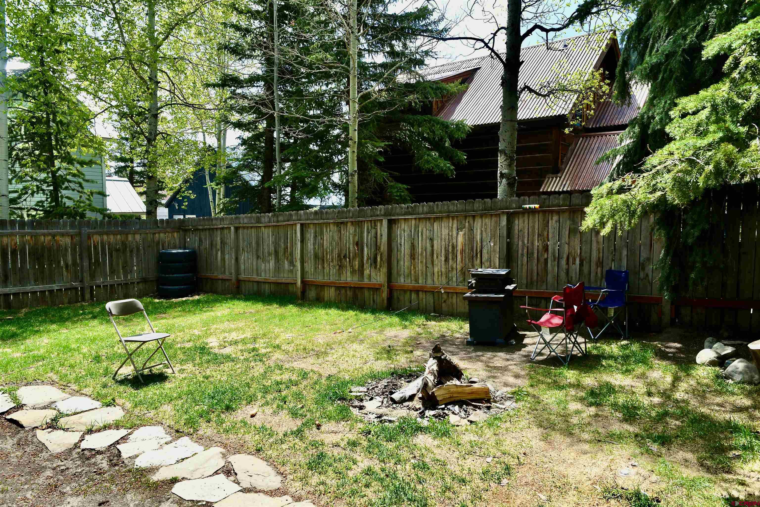 602-604 4th Street Crested Butte, CO 81224 - Photo 27 of 45 a garden with wooden fence
