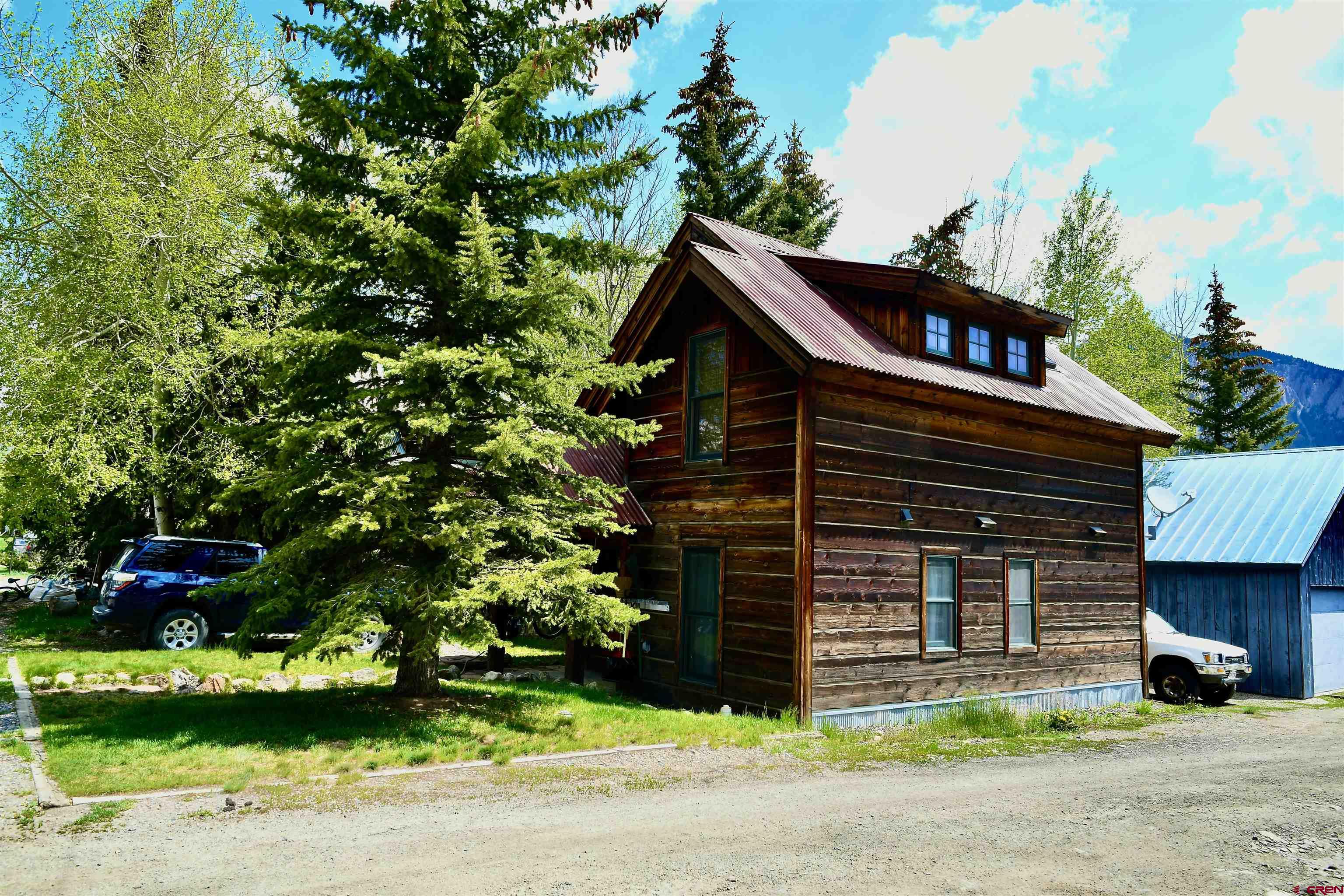 602-604 4th Street Crested Butte, CO 81224 - Photo 4 of 45 a front view of a house with a yard and garage