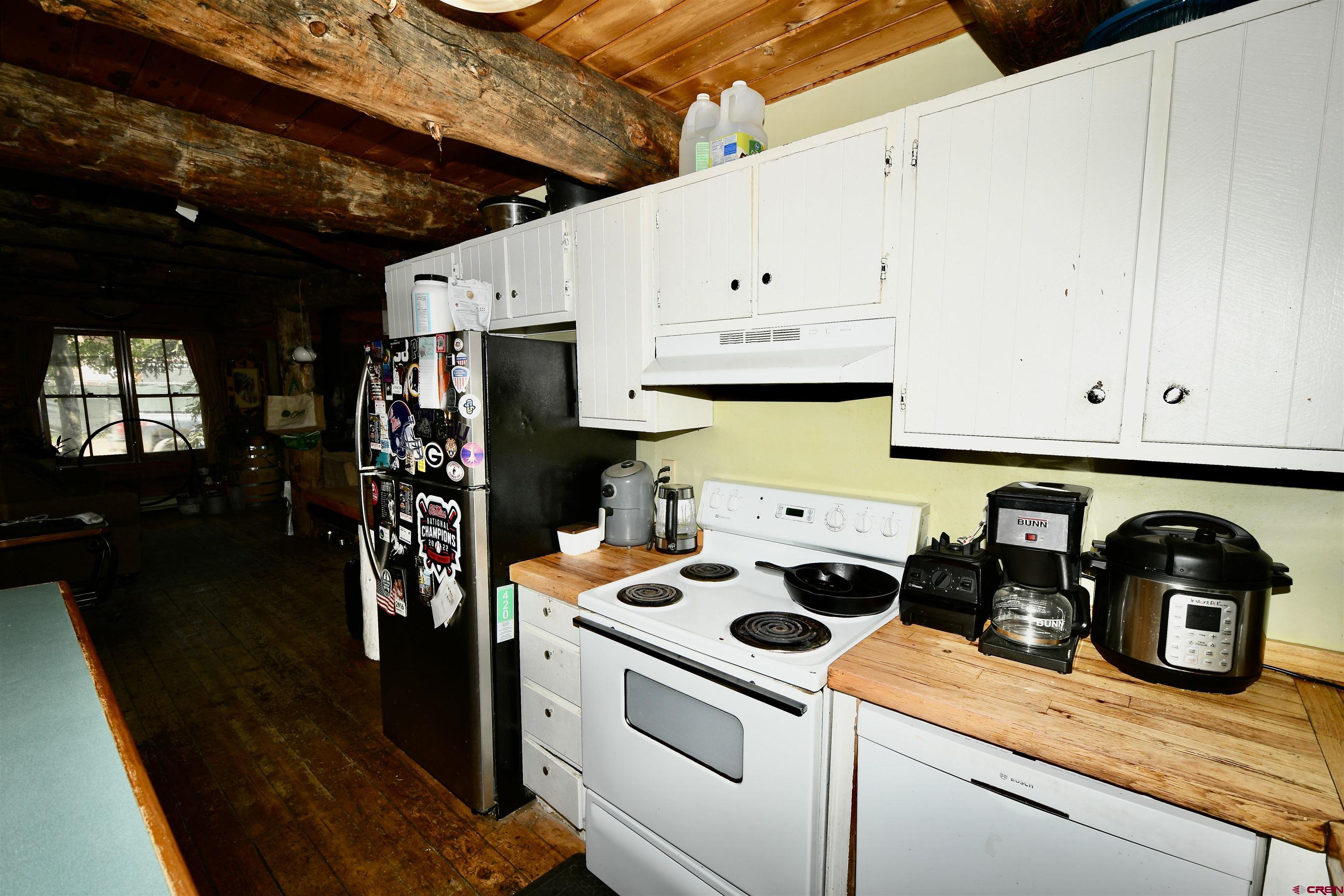 602-604 4th Street Crested Butte, CO 81224 - Photo 45 of 45 a kitchen with a sink a stove and cabinets