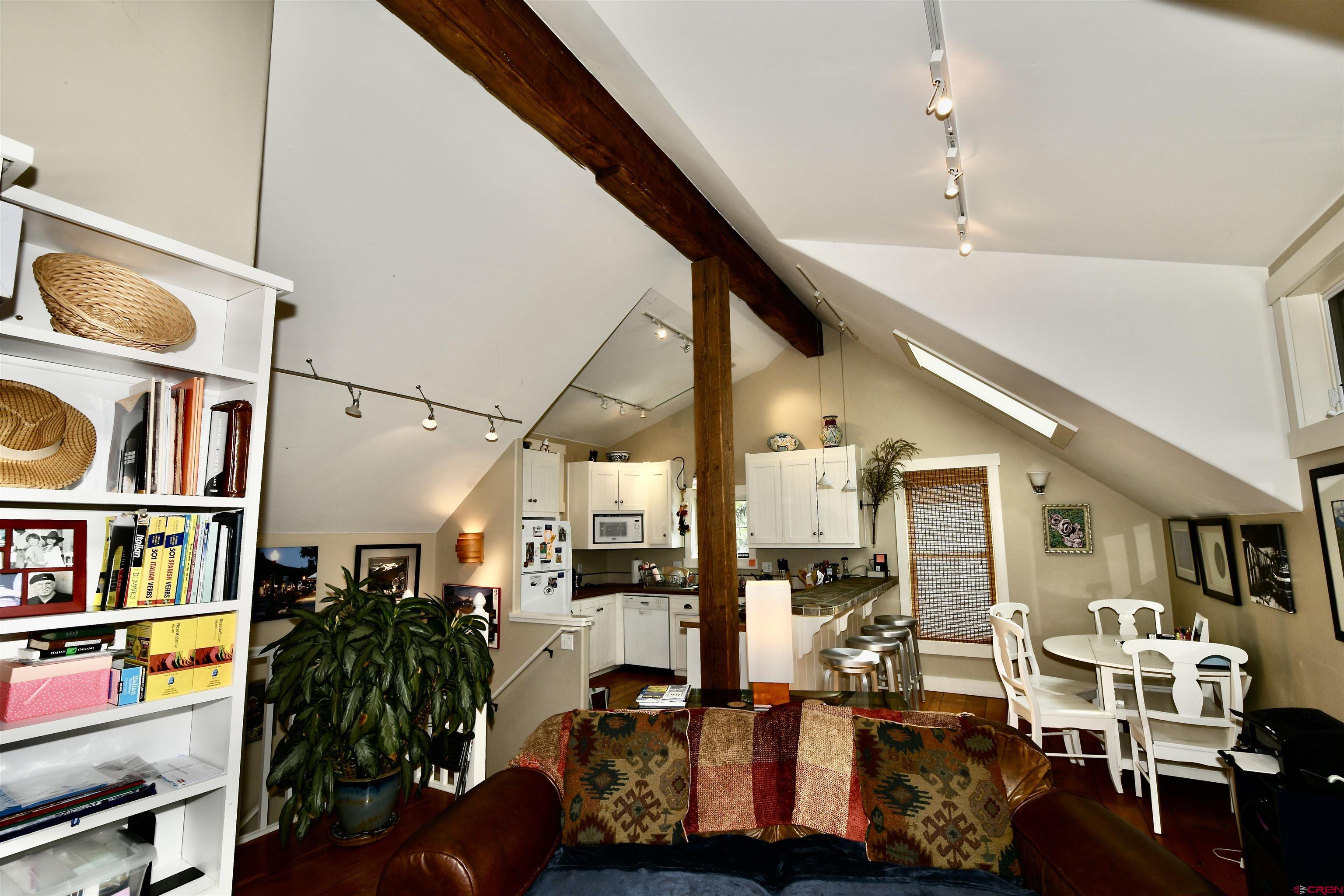 602-604 4th Street Crested Butte, CO 81224 - Photo 6 of 45 a living room with lots of furniture and a book shelf
