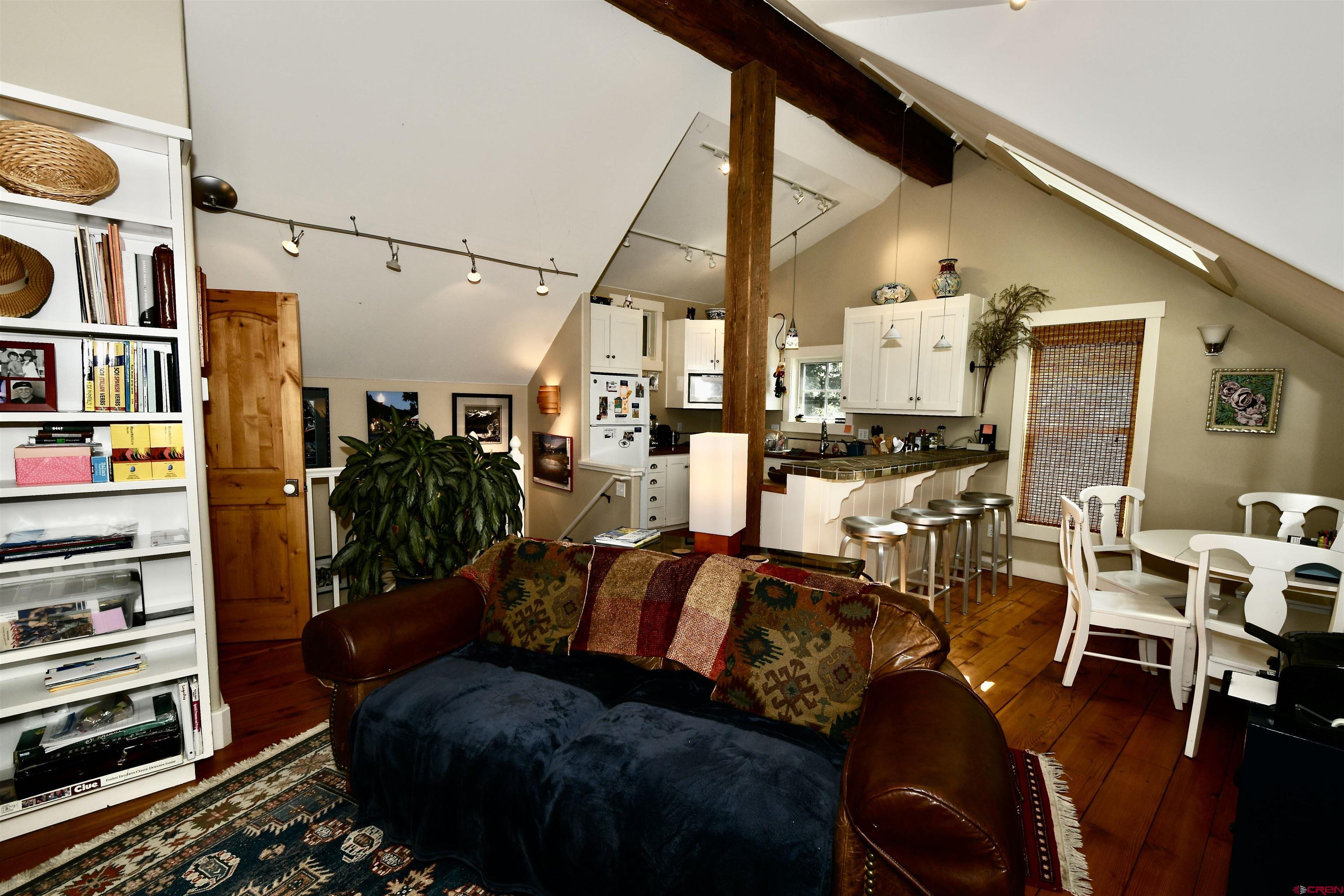 602-604 4th Street Crested Butte, CO 81224 - Photo 8 of 45 a living room with lots of furniture and gym equipment